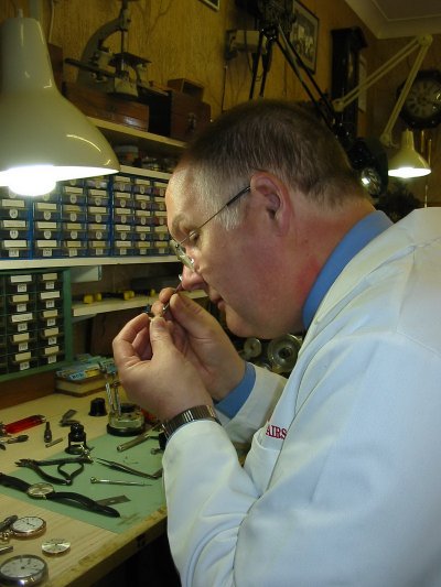 Michael Swift working at his workshop desk